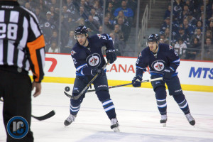 Stafford with puck, Scheifele following up