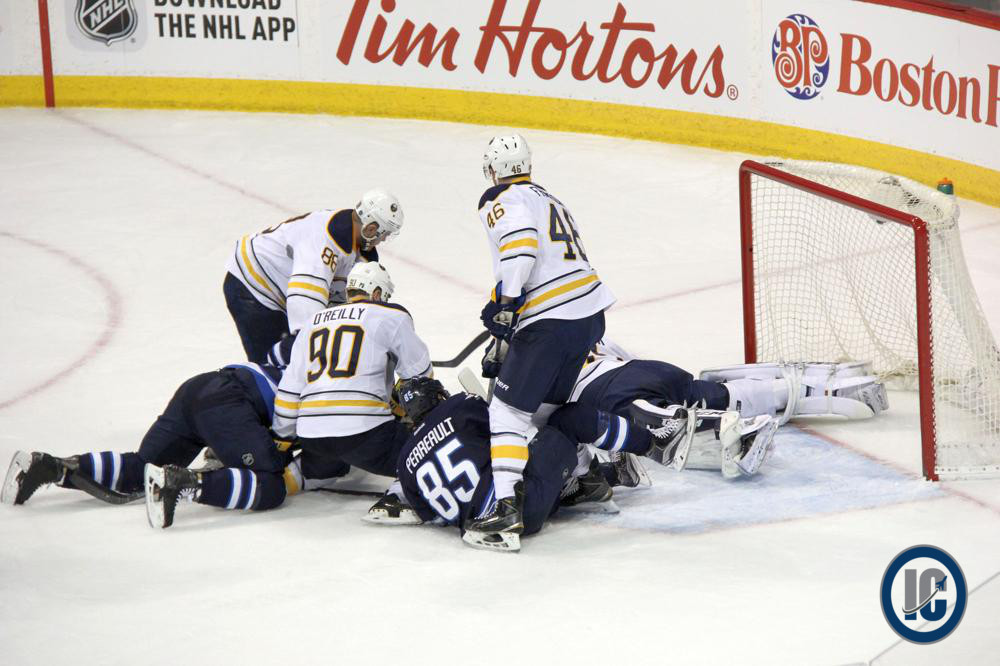 Perreault at bottom of pile