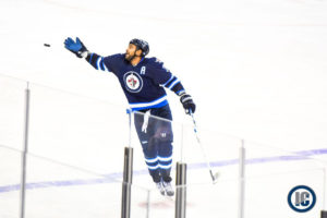 Byfuglien reaching for puck