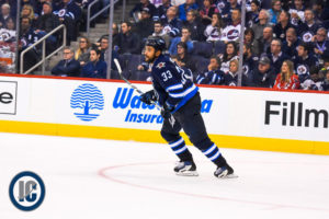 Dustin Byfuglien looks up ice