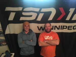 Dave and Ez in front of TSN banner