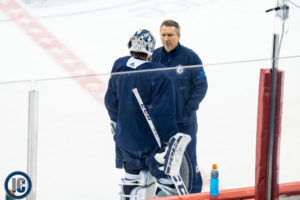 Hellebuyck chats with Flaherty at practice