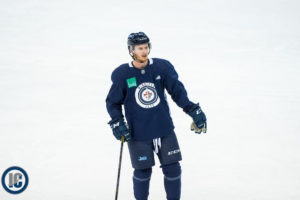 Kyle Connor chatting during practice