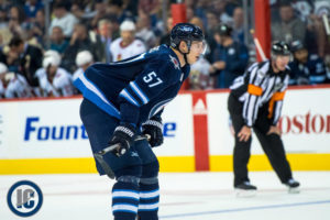 Tyler Myers hunched over