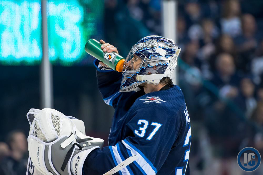 Connor Hellebuyck getting water