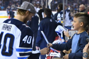Joel Armia signs autographs during break in play
