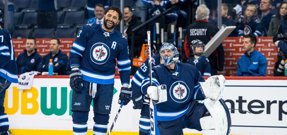 Byfuglien and Hellebuyck share a laugh e1523366930422