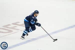 Jacob Trouba heads up ice