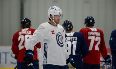 Adam Lowry at training camp with prospects