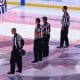 Refs at centre ice