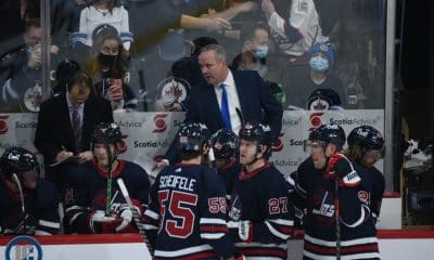Dave Lowry behind Jets bench