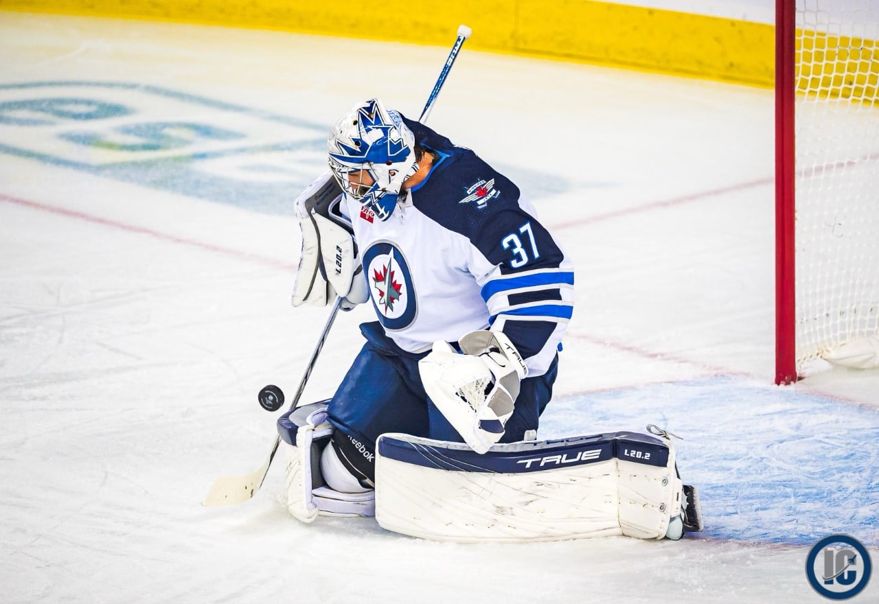 Connor Hellebuyck road save side