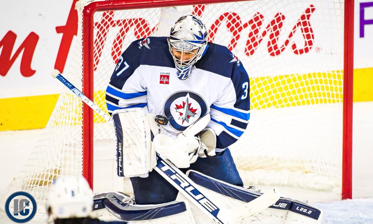 Connor Hellebuyck stop in tight