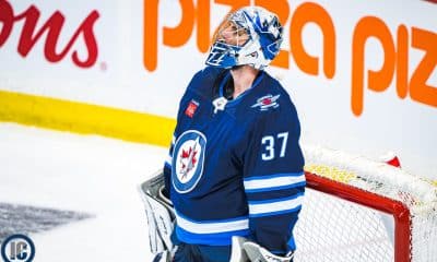 Connor Hellebuyck looking up