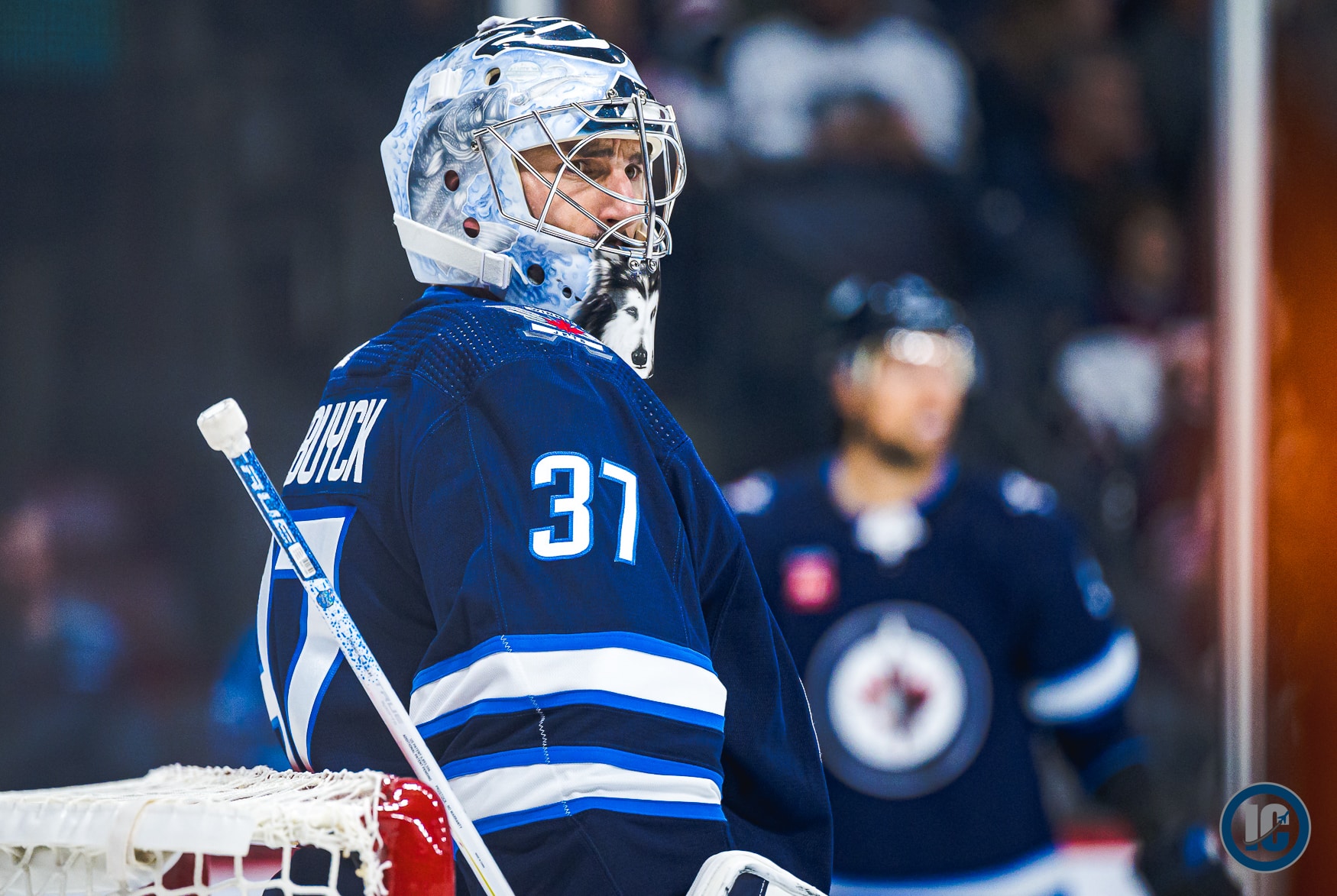 Connor Hellebuyck looking right